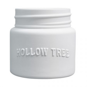 White scent-free candle in a ceramic vessel from Hollow Tree