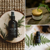 Travel scent bundle with dark glass mist spray bottle and gold-lidded tin