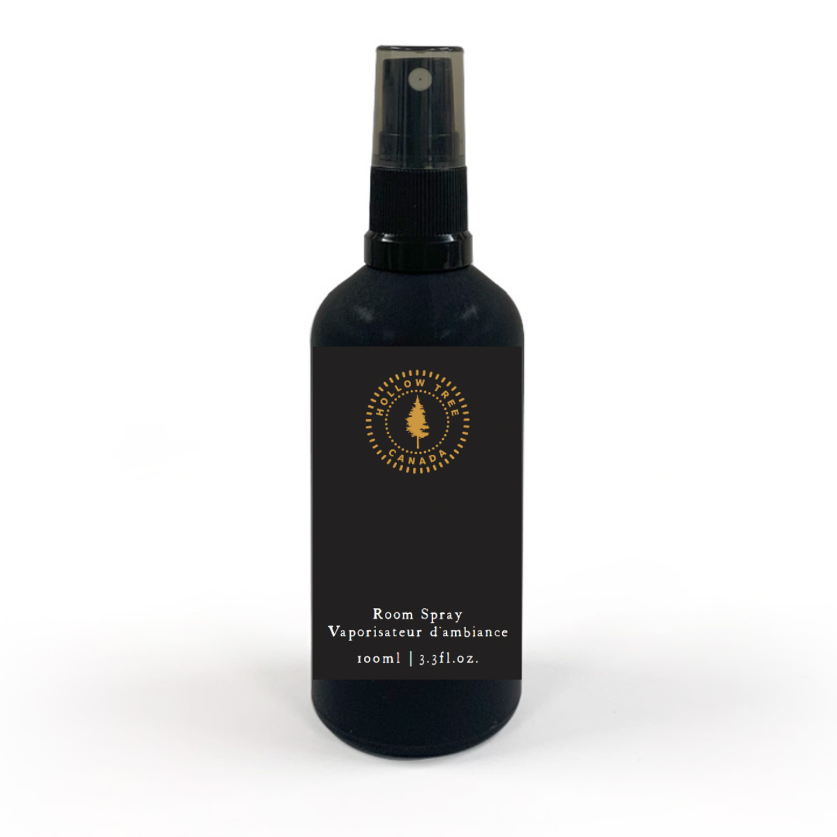 A black room spray bottle with white and gold text, labeled 'Lumberjack' and describing the scent as woodsy with notes of Santal, Fir Needle, and Cedar Resin.