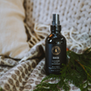 Room spray bottle with silver mist nozzle, dark label reading Lavender and Cedarwood