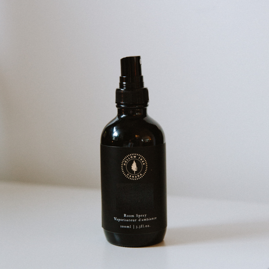 Lumberjack room spray bottle, dark glass with spray nozzle and round logo label.