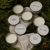 Open scent pod tins with labels: Cathedral Grove, Hollow Tree, The Lions, Golden Spruce