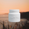Light blue-white jar candle with ridged lid and embossed "HOLLOW TREE" text
