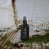 Voyageur room spray bottle with dark amber glass and silver mist sprayer