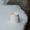 White candle jar with exposed wick