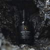 Room spray bottle with black spray cap and dark glass, Whistler Mountain label