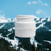 White jar candle with ridged lid and embossed "HOLLOW TREE" wordmark