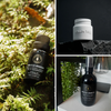 Whistler Mountain scent bottles, one spray bottle with dark glass and gray cap